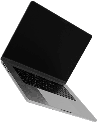 An open laptop with a black screen is tilted slightly to the left, displaying a silver keyboard and trackpad.