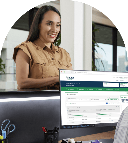 Woman signing up for financing at a counter